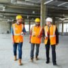 Site Safety Responsibilities UK construction workers wearing PPE on a building site
